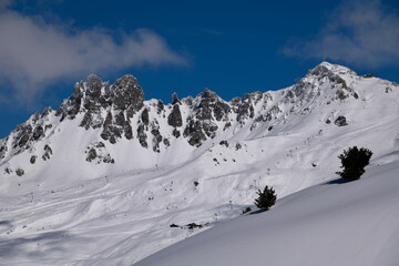 Roc de Tougne ski chairlift at the Meribel Valley in France. Amazing landscape view on the sunny winter day.