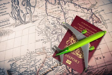 Fototapeta na wymiar tourism travel, plane model, passport and retro map
