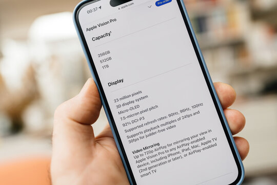 California, USA - Jan 21, 2024: A male hand holds the iPhone 15 Pro, with storage capacities of 256GB, 512GB, and 1TB, perfect for the new Apple Vision Pro mixed reality headset developed by Apple Inc