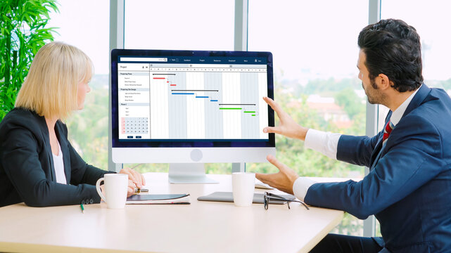 Project planning software for modish business project management on the computer screen showing timeline chart of the team project