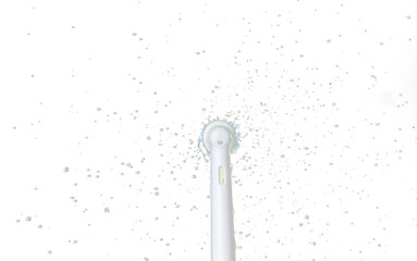 Electronic Brush spin with droplet splash around. Water Droplet splash all around electronic brush. Black background isolated, brush blur focus on water