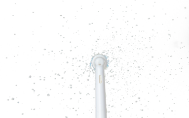 Electronic Brush spin with droplet splash around. Water Droplet splash all around electronic brush. Black background isolated, brush blur focus on water