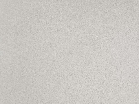 white concrete or plaster wall with a rough texture