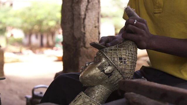 Filling a metal sculpture. Close up