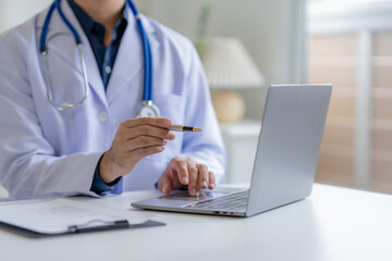 Doctor with Laptop Offering Medical Consultation Online