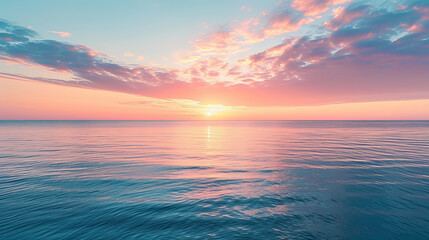 Peaceful sunrise over a tranquil ocean with pastel skies
