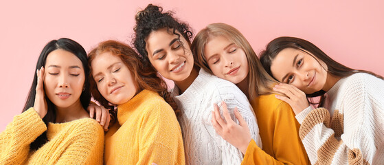 Beautiful happy young women on pink background. Women History Month