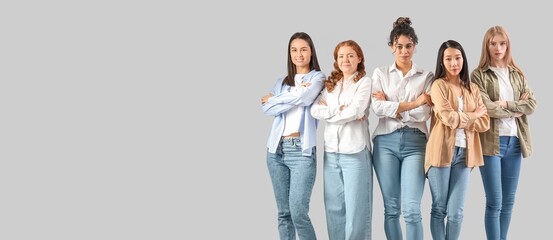 Beautiful confident young women on light background with space for text. Banner for Women History Month