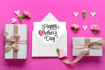 Envelope with greeting card for Mother's Day, gifts, hearts and flowers on bright pink background, top view