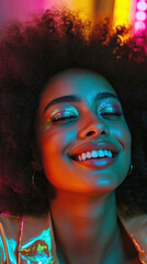Obraz premium Radiant Joy: A Close-Up of a Joyful Young Woman with Afro Hair, Captured in a Vivid and Colorful Portrait, Illuminated by Soft, Bright Light