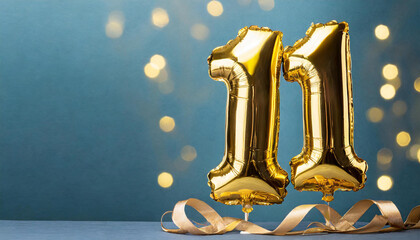 Banner with number 11 golden balloon with copy space. eleven years anniversary celebration concept on a blue background.