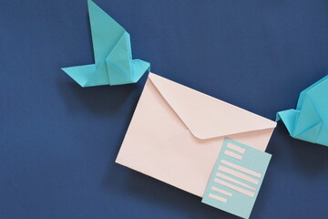 Two birds paper origami carrying letter envelope. Receiving email or mail such as invitation and...