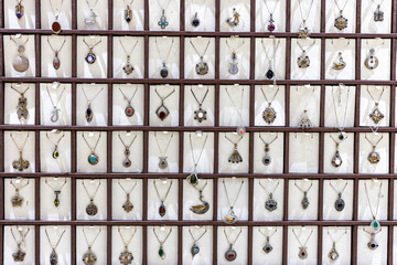 Detail shot of a store in Midyat, Mardin, where silver-made rings, necklaces and Assyrian evil eye beads are sold.