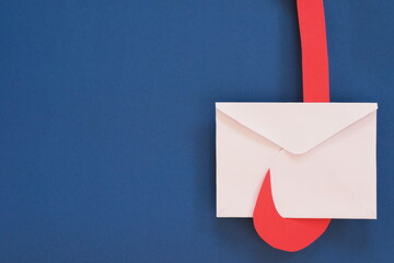 Letter envelope on a hook. Clickbait email scam and message.