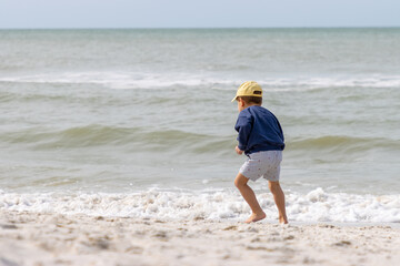 Boy playing on beach