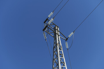 Low angle views of a high voltage cable tower