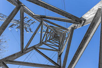 Low angle view of some high voltage pylons