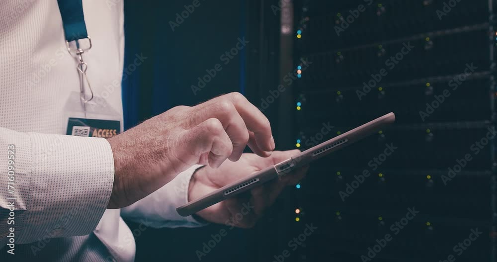 Fototapete Man in data center typing on tablet, inspection or network maintenance with engineer in storage for database update. Tech service, system administration and technician on digital app in server room.