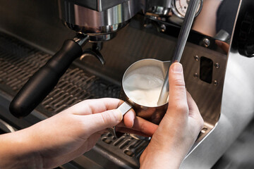 Steaming Milk in Stainless Steel Tumbler with Espresso Machine