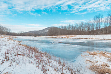 Frozen over river extreme cold weather copy space winter landscape background 