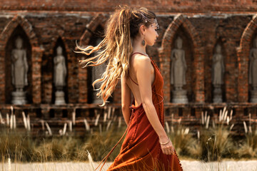 beautiful young woman in elegant dress at asian temple - 716118989