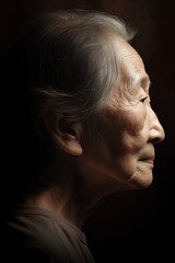 Portrait of an elderly woman. Studio shot on dark background.