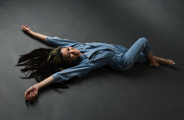 Full length portrait of brunette female asian model wearing casual clothes, double denim jean...