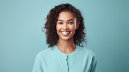 Portrait of happy smiling young african american woman with curly hair over blue background - obrazy, fototapety, plakaty