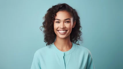 Cercles muraux Pleine lune Portrait of happy smiling young african american woman with curly hair over blue background