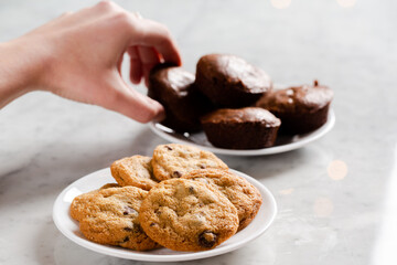 Hand taking gluten free brownies