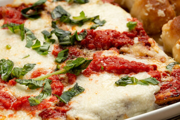 Close up of pizza with bread knots