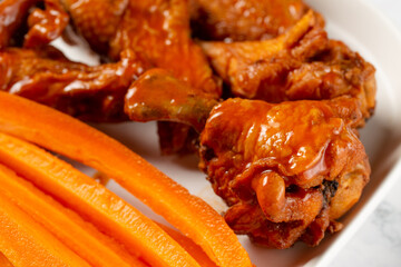 Buffalo wings and carrots