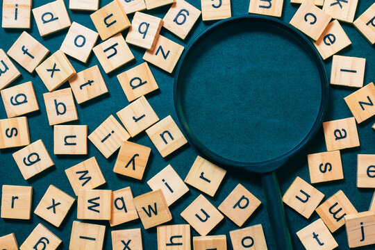 English letters scattered on a black background Ideas for developing grammatical thinking English learning concept