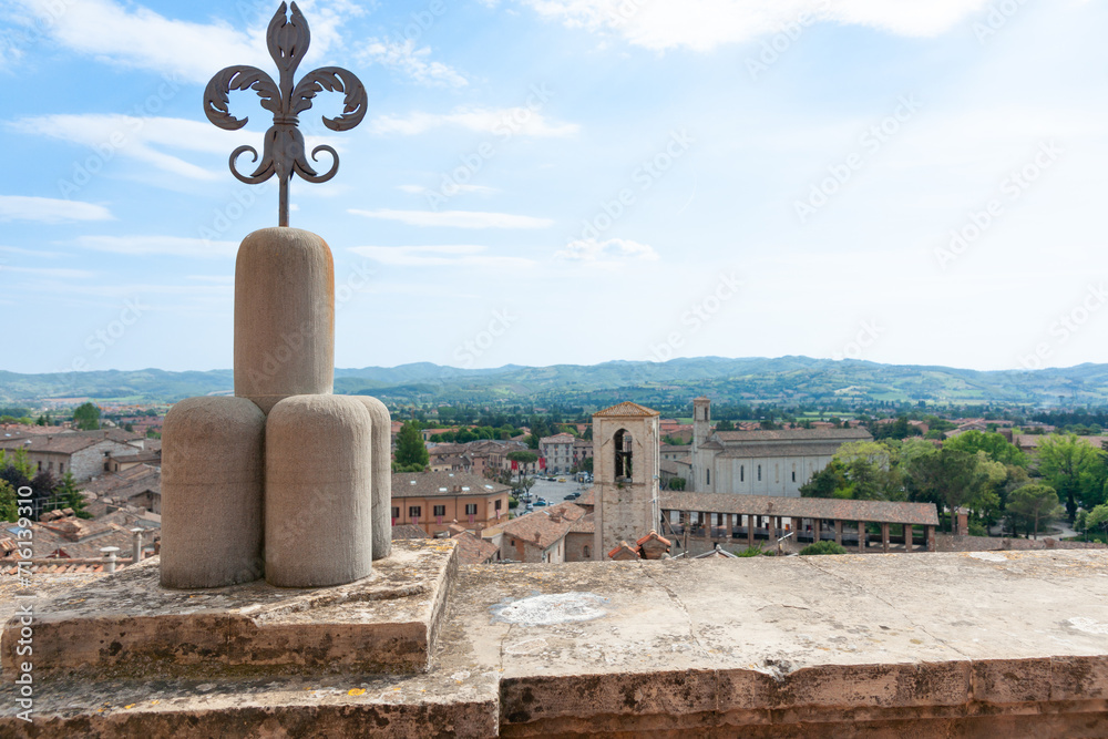 Sticker decorative iron fleur de lis on top of wall overlooking city and landscape