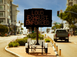 Digital sign stating Loud Exhaust Enforced in attempt to reduce loud car noise