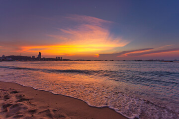 Beautiful summer beach and sea and yellow orange sky at the sunset, twilight period which including...