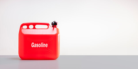 Red gasoline tank on white background. Can, canister for transportation petroleum product. Banner...
