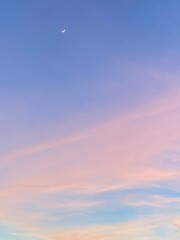 Pinky and blue sky with moon during sunset