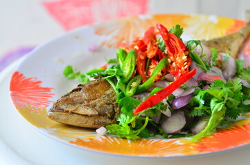 The fried salted mackerel with coriander and red pepper set for meal.