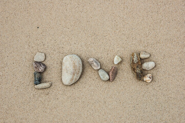 Fototapeta na wymiar To set the stone on the beach for telling the feeling to the lover. This pic can be used for Valentine's event.