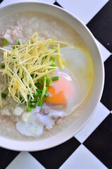 The rice porridge with pork, egg and ginger, it's good for health and easy for eating.