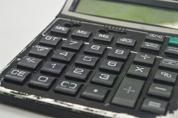 Obraz premium a black calculator isolated on white background. perfect for Education, mathematics, and Business Article or Content.