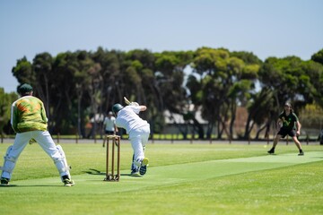 playing a game on a green over for health and recreation in australia in summer