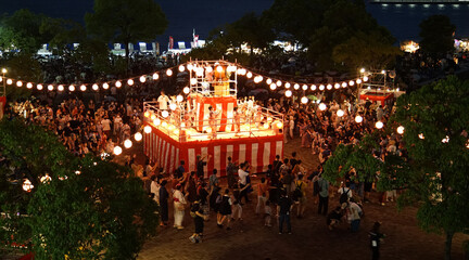 Night view of the stage of a summer festival in Japan and the light of lanterns © aozora