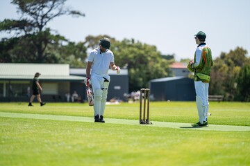 playing a game on a green over for health and recreation in australia in summer