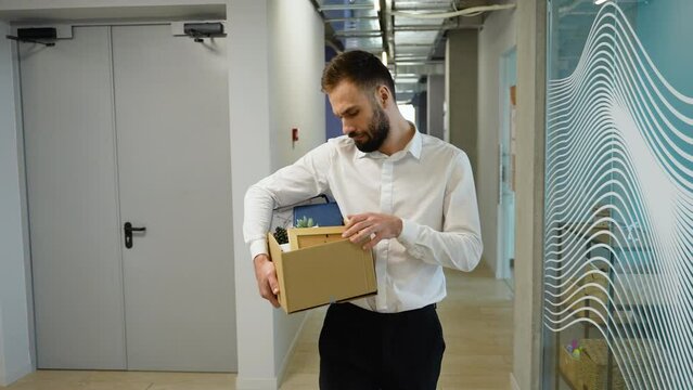 Unemployed man leaves of workplace. Dismissal from work. Job loss. Unemployment