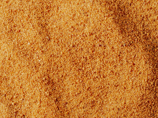Background texture of raw organic coconut sugar from crystallized sap of cut flower buds coconut...