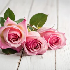 Naklejka premium Flowers of pink roses on white wood background. Happy Valentine's Day with this romantic greeting card.