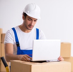 Young male professional mover doing home relocation