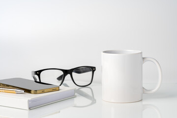 Coffee mug on white office table mock up